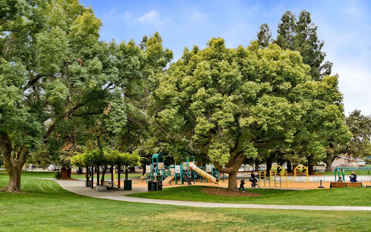 Green neighborhood park with playground near Homestead Villa